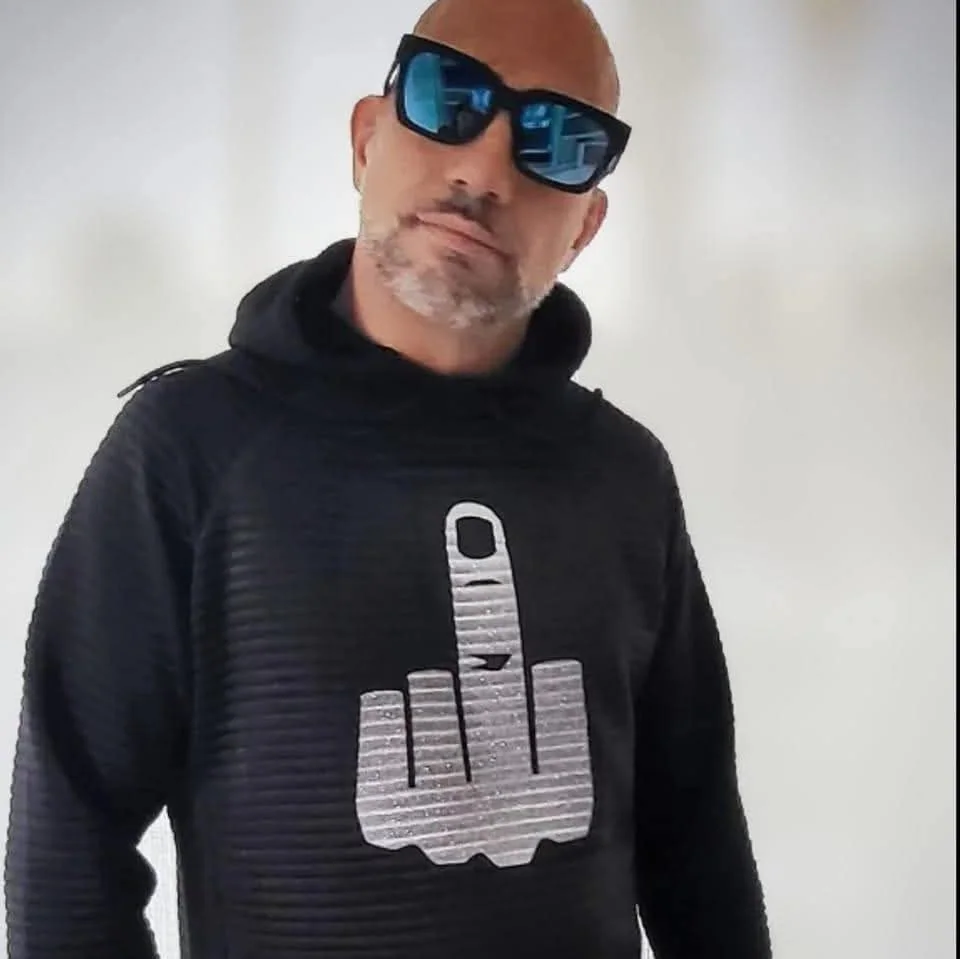 Artist-supplied photo of AFTER HOUR KAINE in sunglasses and a black hoodie