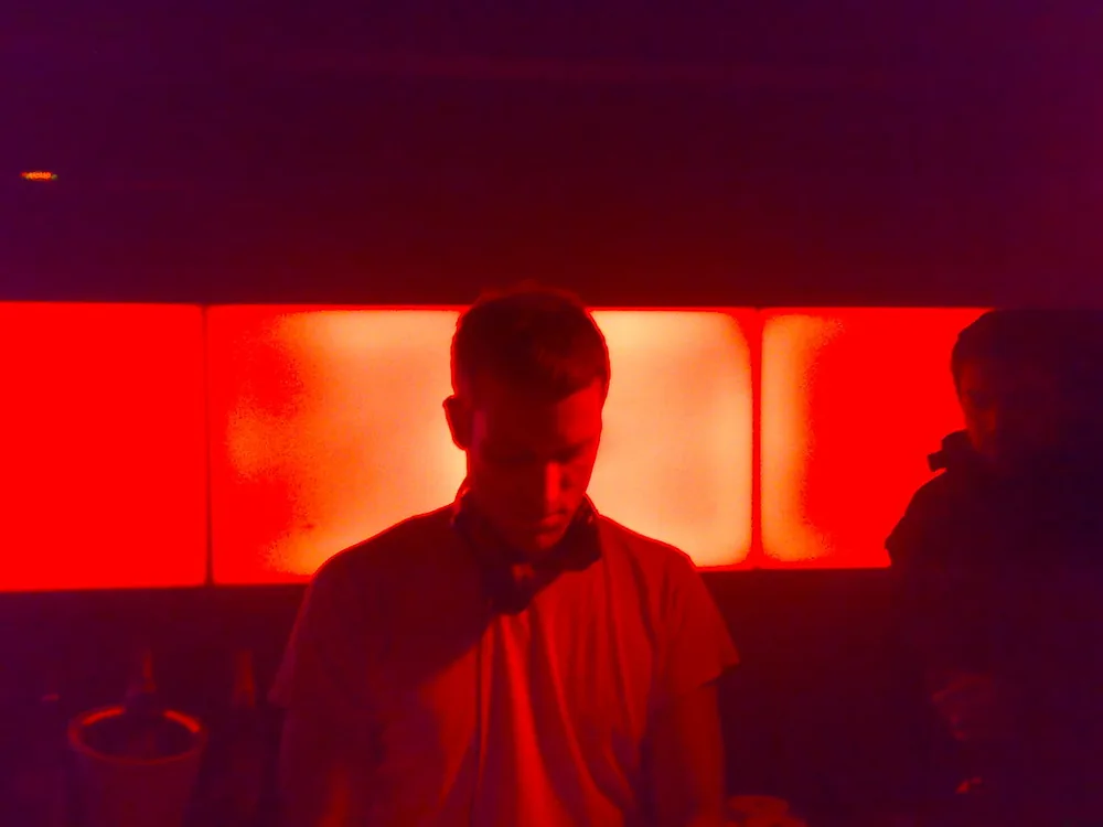 Authentic archival photograph of billed artist Ben Klock DJing at Culture Box Copenhagen; whole main performer’s head visible; not an official Fabric flyer or photograph from the 2026 London event