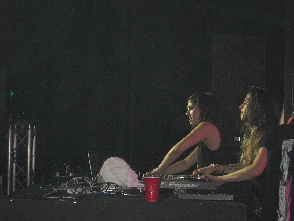 Krewella members Jahan and Yasmine Yousaf performing in Milwaukee in 2013; archival photo of a billed performer at KREWELLA + NERVO — ROOFTOP HALLOWEEN, not this event