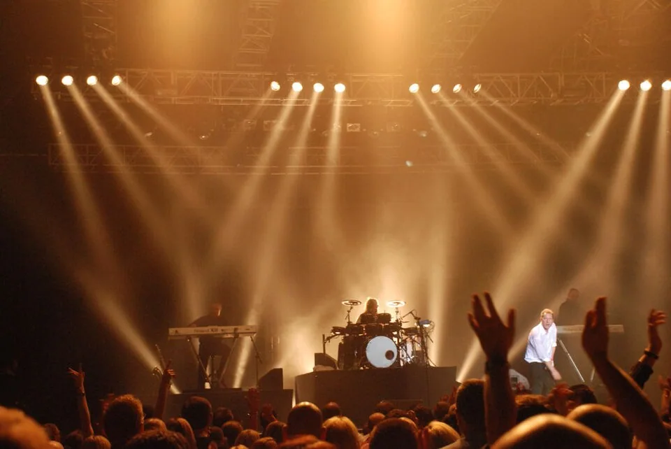 Orchestral Manoeuvres in the Dark live onstage at the Liverpool Summer Pops festival; archival artist photo, not the 2027 Philharmonic event; historical photograph of Orchestral Manoeuvres in the Dark, NOT the official image of ORCHESTRAL MANOEUVRES IN THE DARK + ROYAL LIVERPOOL PHILHARMONIC